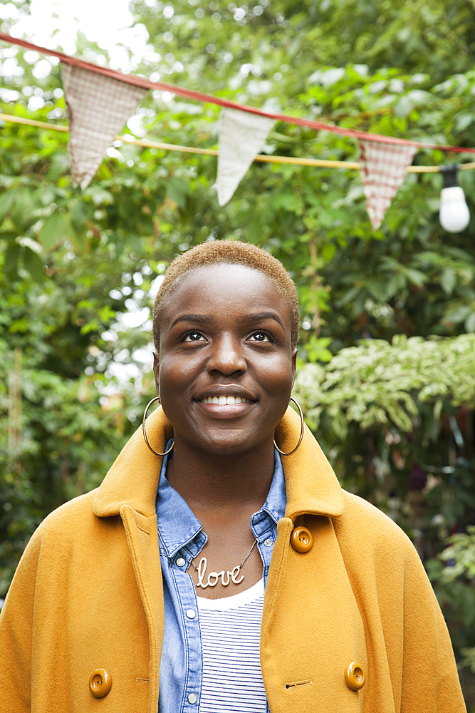 Portrait of smiling Black woman looking up