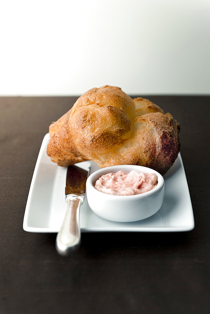 Popover with strawberry butter on plate