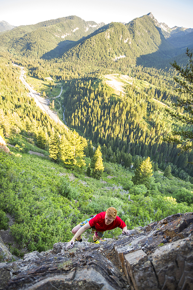 Caucasian man rock climbing