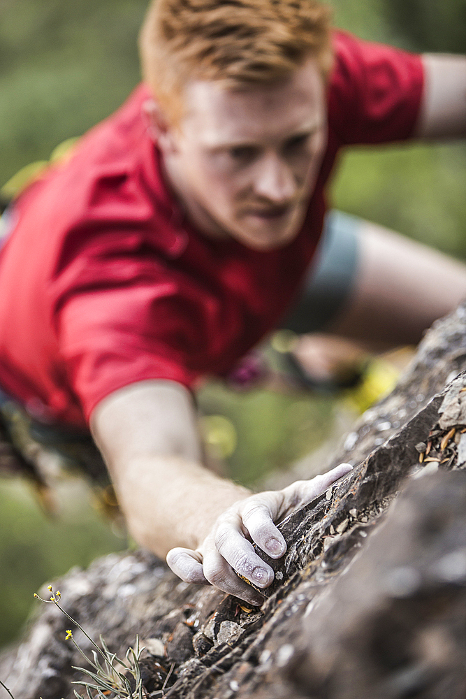 Caucasian man rock climbing