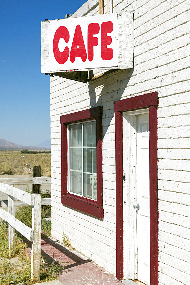 Cafe sign on abandoned building