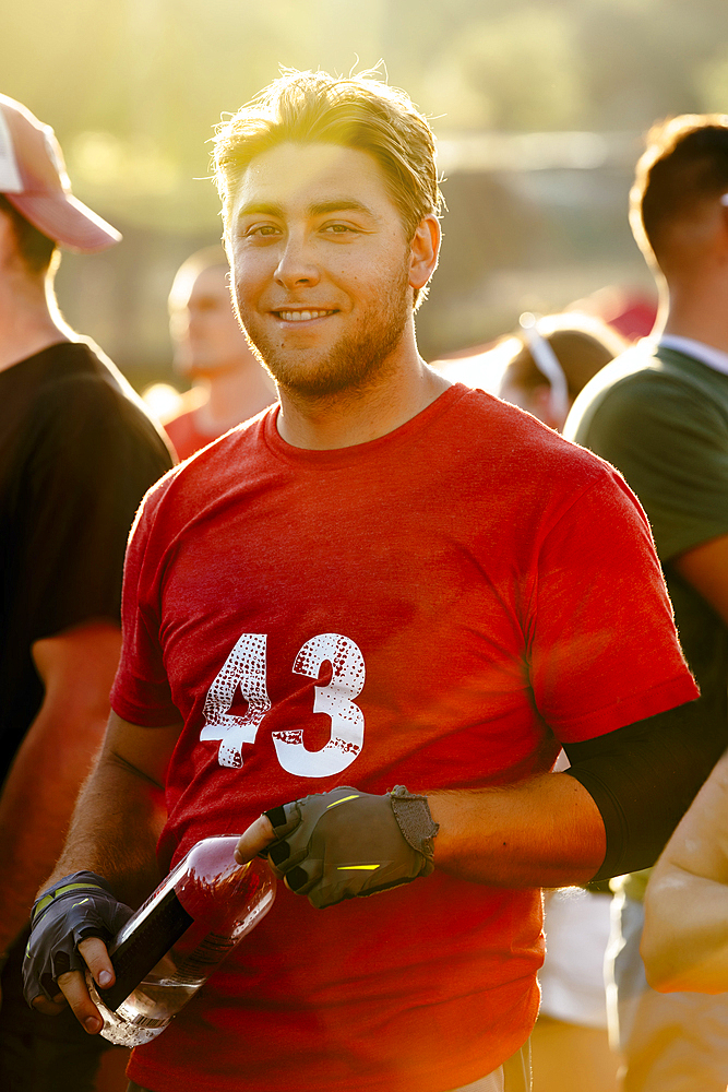 Portrait of smiling Caucasian man holding water bottle