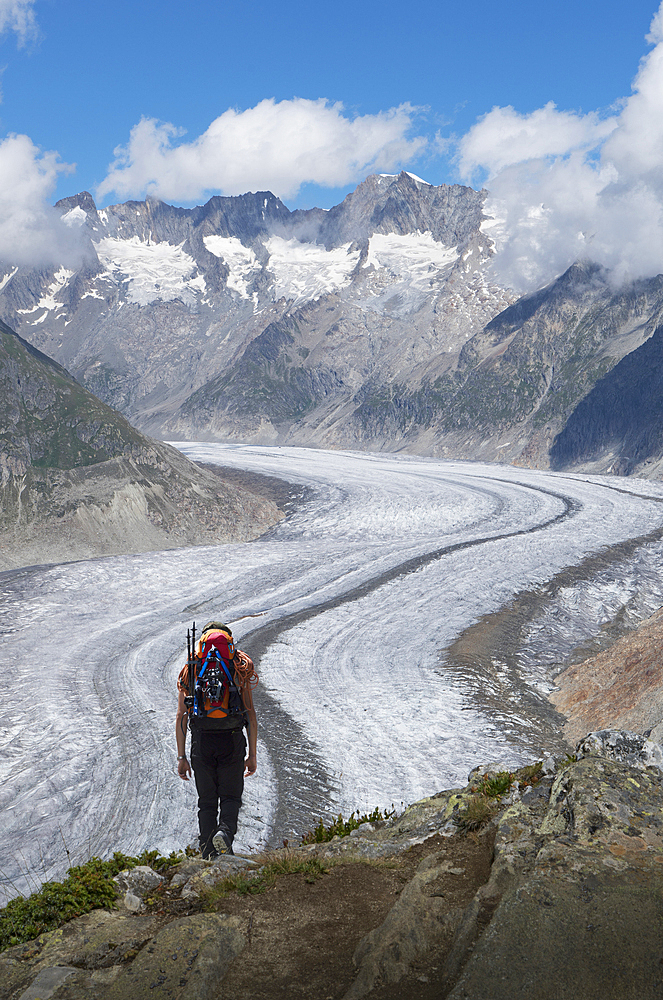 Caucasian man hiking in snowy mountains