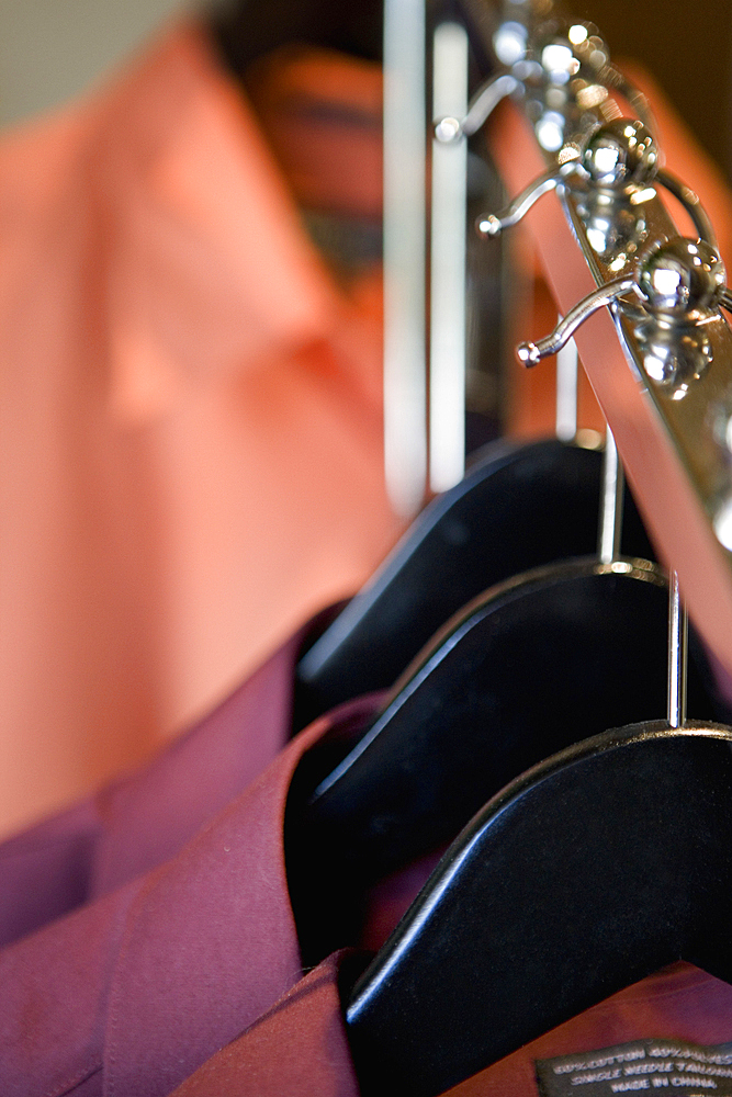 Store Display of Collared Dress Shirts Hanging from Chrome Rack