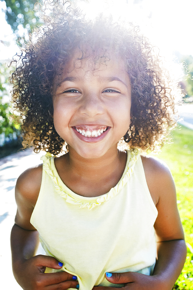 Mixed Race girl smiling outdoors