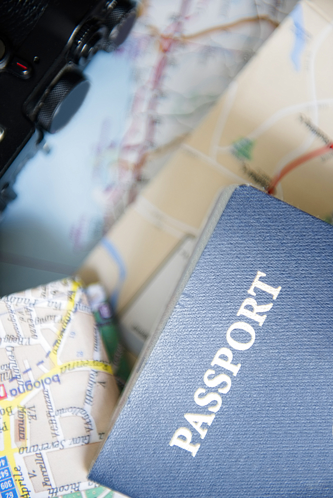 Passport, maps and camera