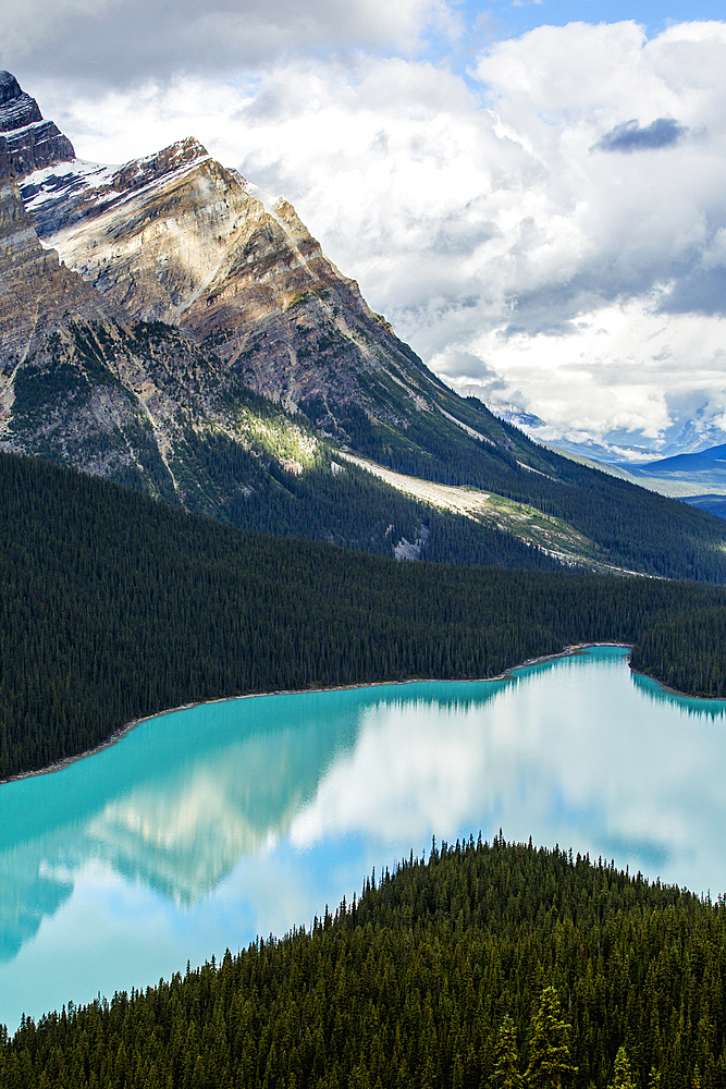 Reflection of clouds in still mountain lake