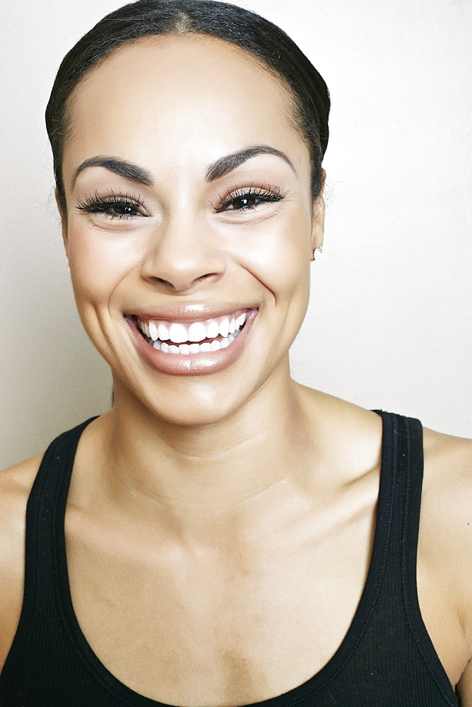 Portrait of laughing Mixed Race woman