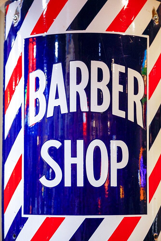 Close-up of barber shop sign