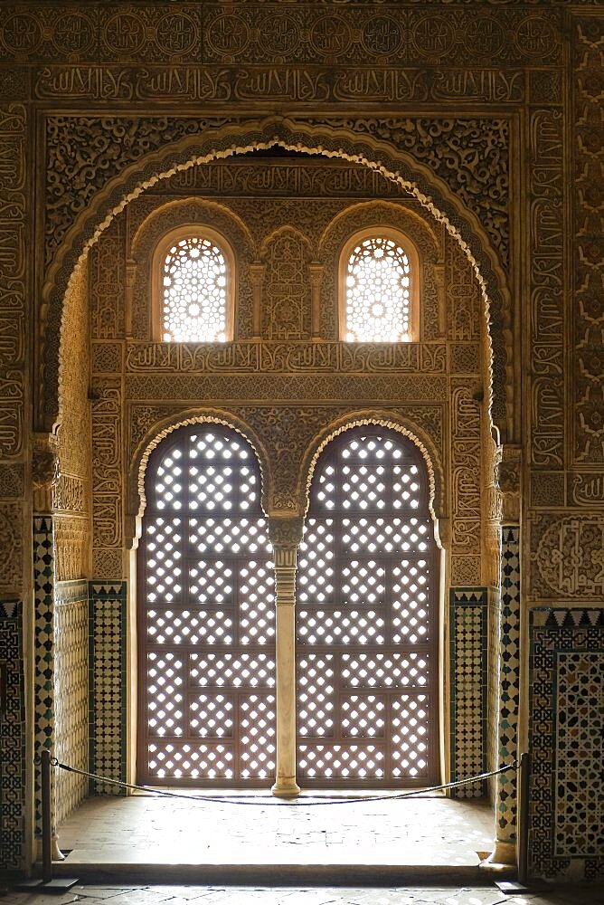 Spain, Granada, Lattice windows and ornate walls in The Alhambra