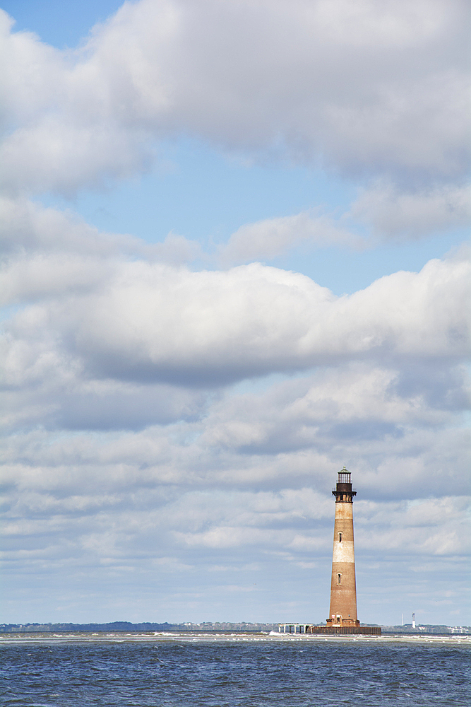 Morris Island Light against cloudy sky