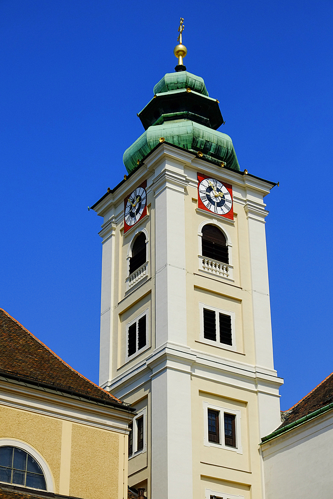 Clock tower of Schottenkirche against clear sky, Vienna, Austria