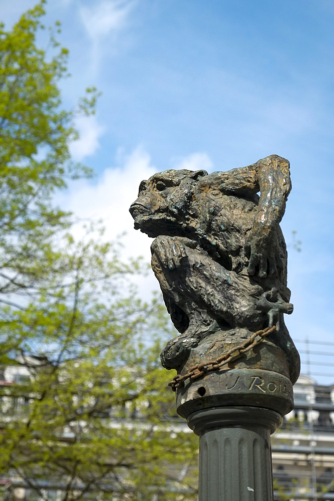 Scratching monkey statue on top of column, Brussels, Belgium