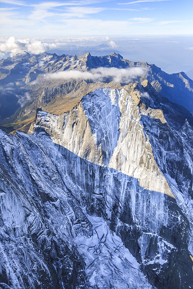 Aerial view of the north face of Piz Badile located between Masino and Bregaglia Valley, border of Italy and Switzerland, Europe