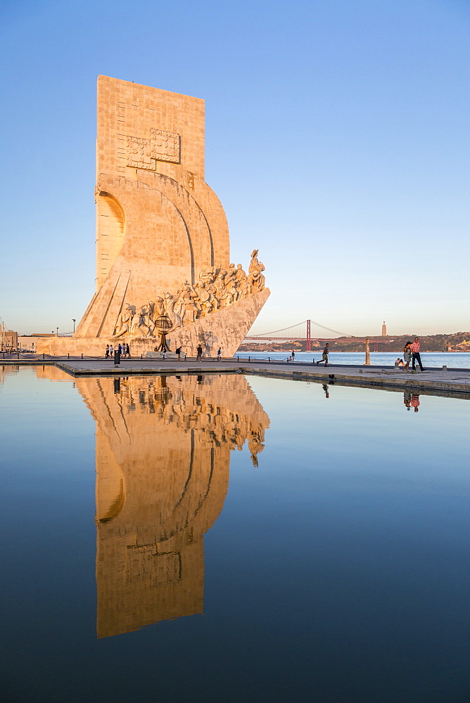 Sunset on the Padrao dos Descobrimentos (Monument to the Discoveries) reflected in Tagus River, Belem, Lisbon, Portugal, Europe