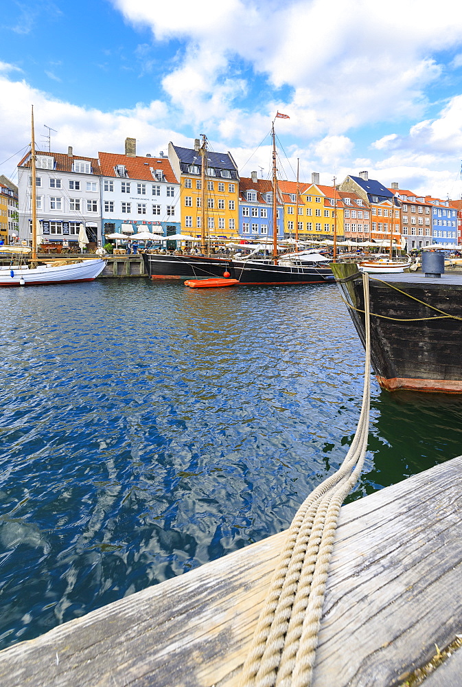 Colourful facades and typical boats along the canal and entertainment district of Nyhavn, Copenhagen, Denmark, Europe