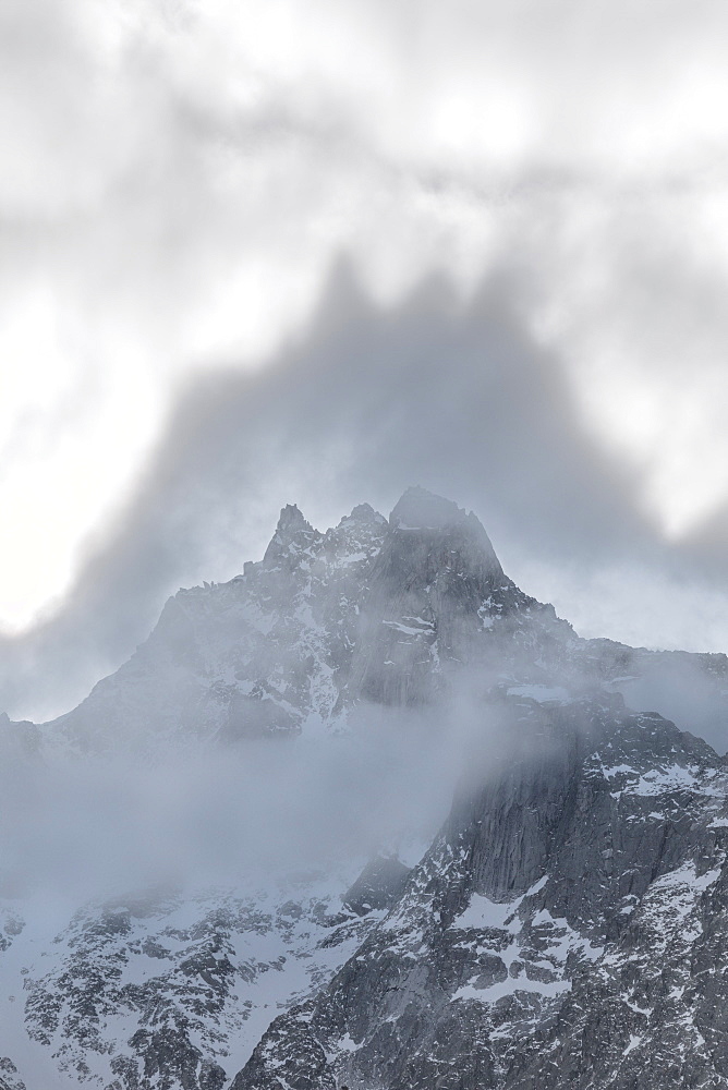 Shapes above peaks created by mist, Cime Del Largo, Bregaglia Valley, Canton of Graubunden (Grisons), Switzerland, Europe