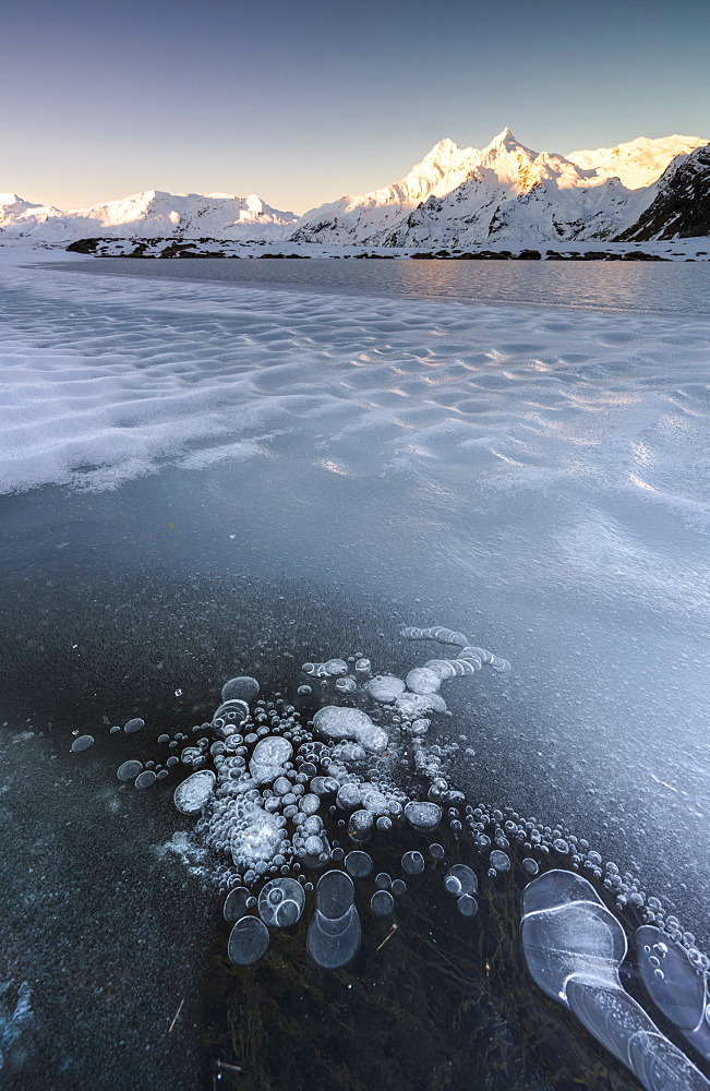 Frozen Lake Andossi in Spluga Valley, Italy, Europe