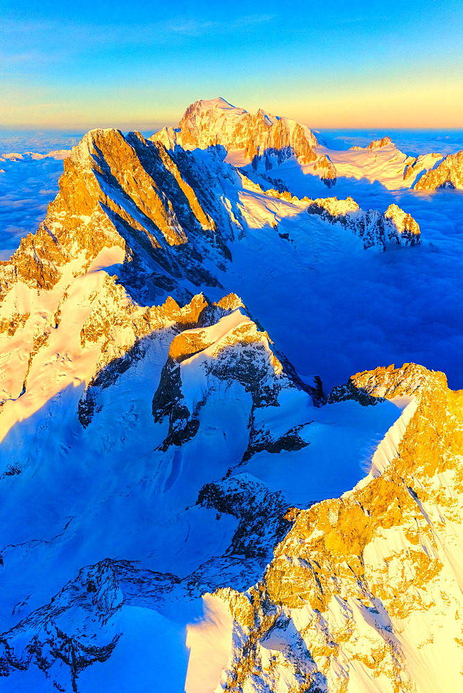 Aerial view of Grandes Jorasses, Petites Jorasses, Aiguille De Leschaux and Mont Blanc at dawn, Courmayeur, Aosta Valley, Italy, Europe