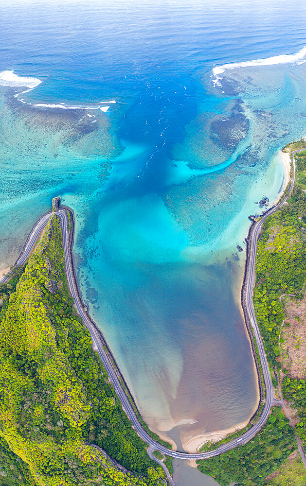 Coastal road facing the turquoise lagoon, aerial view by drone, Bel Ombre, Baie Du Cap, South Mauritius, Indian Ocean, Africa