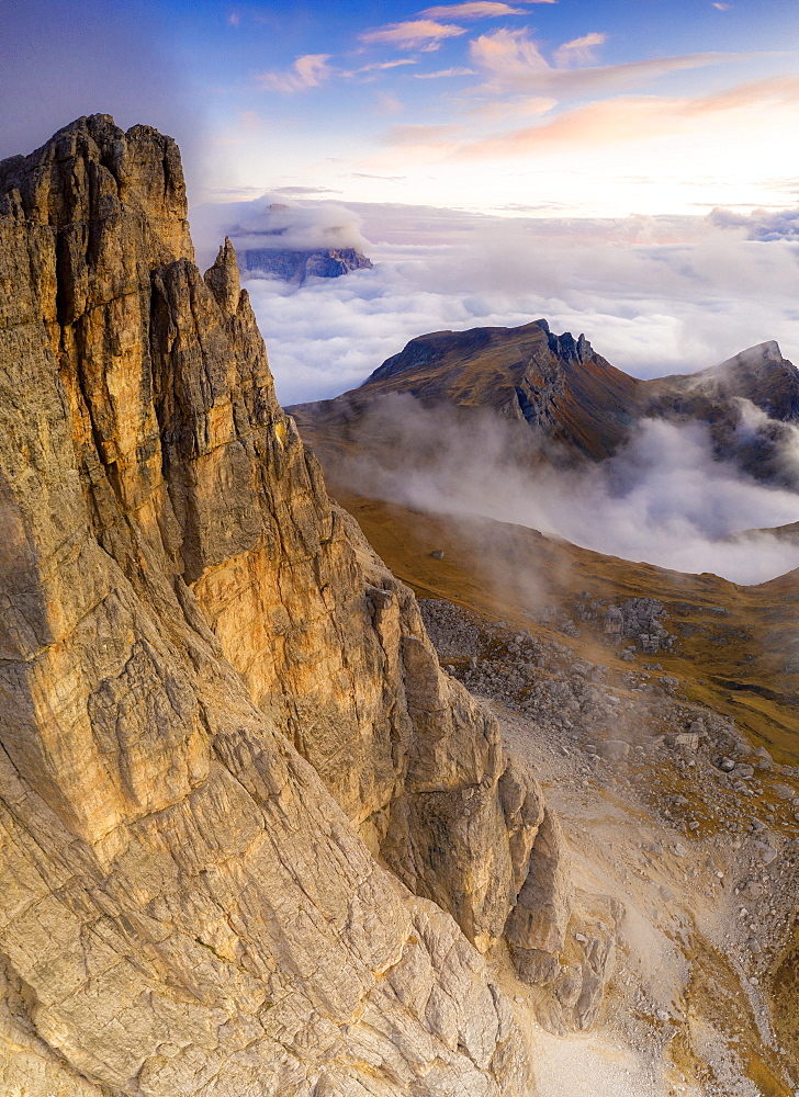 Aerial view by drone of autumn sunset over Lastoi De Formin, Mondeval and Monte Pelmo, Giau Pass, Dolomites, Belluno, Veneto, Italy, Europe