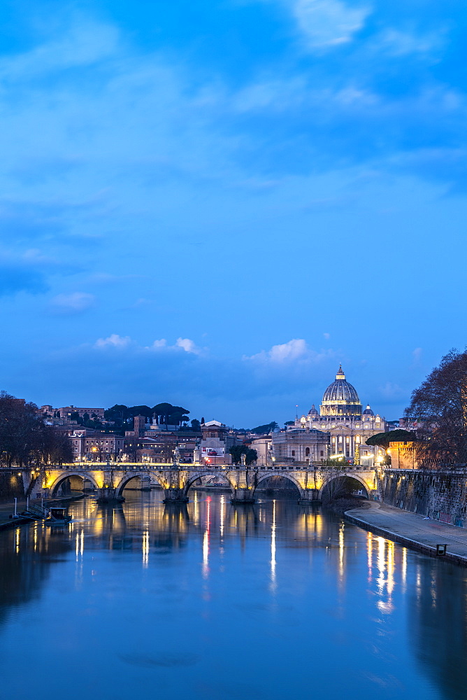 River Tiber with Umberto I Bridge and St. Peter's Basilica (Basilica di San Pietro) in background at dusk, Rome, Lazio, Italy, Europe