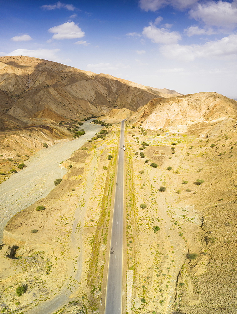 Panoramic view by drone of straight empty road through Danakil desert, Afar Region, Ethiopia, Africa