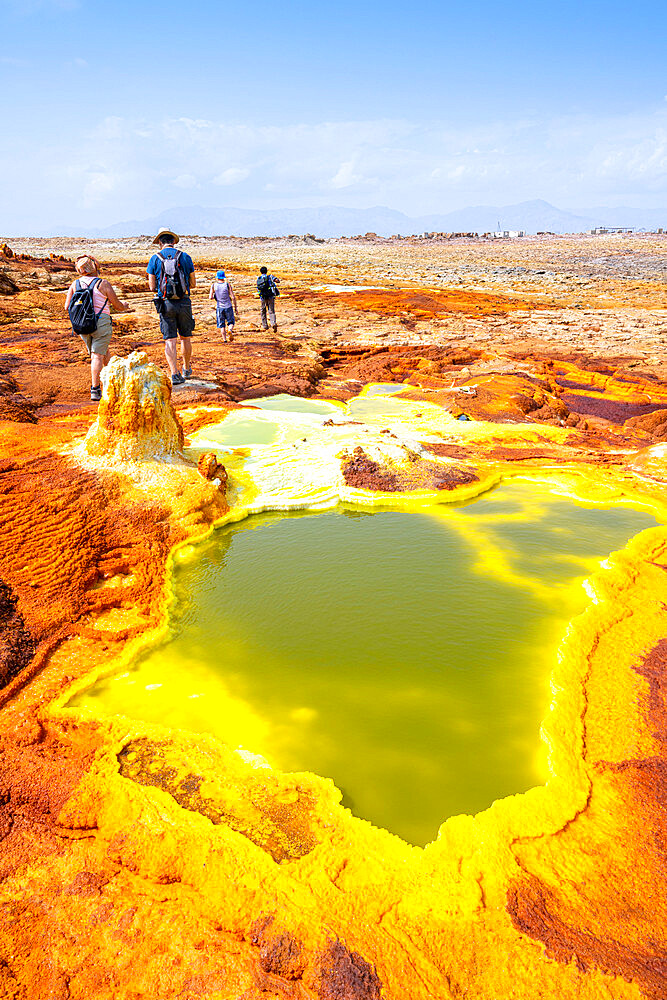 Tourists looking at hot springs and sulphur ponds, Dallol, Danakil Depression, Afar Region, Ethiopia, Africa