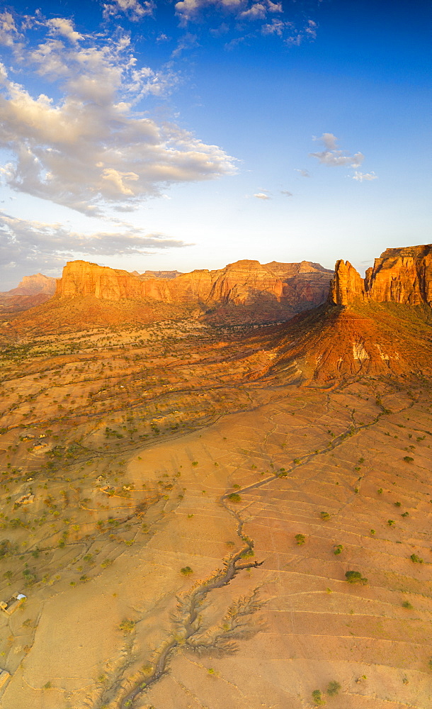 Aerial panoramic by drone of Gheralta Mountains lit by sunset, Hawzen, Tigray Region, Ethiopia, Africa