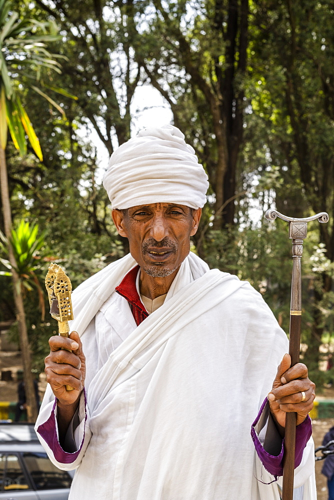 Portrait of Ethiopian Orthodox priest holding the praying stick, Addis Ababa, Ethiopia, Africa