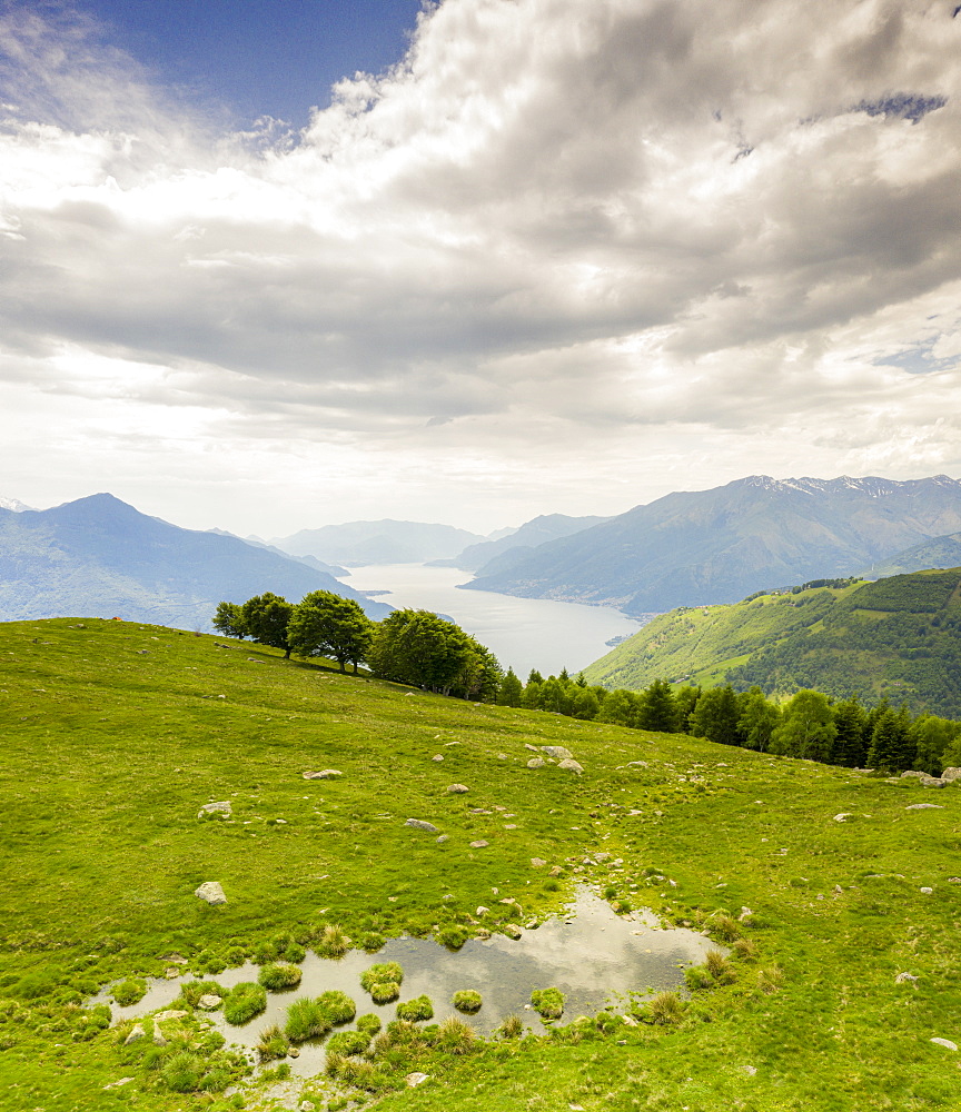 Alto Lario and Lake Como seen from green meadows of Montemezzo mountains, Lombardy, Italian Lakes, Italy, Europe