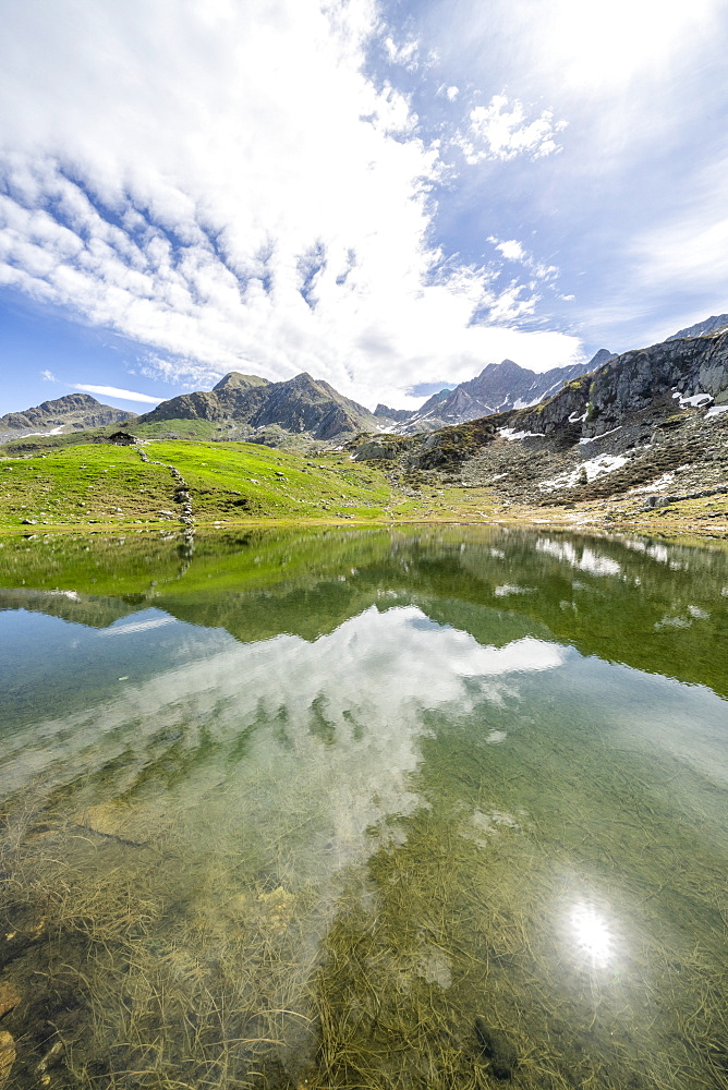 Sunlight over mountain peaks overlooking Porcile Lakes, Tartano Valley, Valtellina, Sondrio province, Lombardy, Italy, Europe