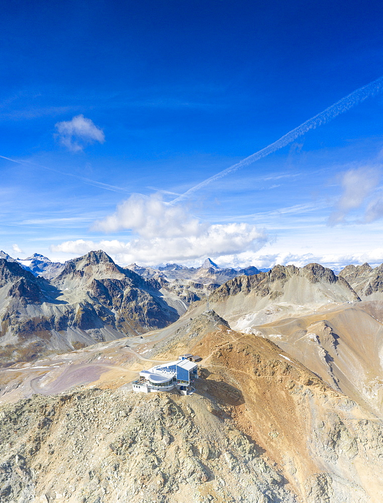 Aerial by drone of clear sky over Piz Nair and cable car station on top, Engadine, canton of Graubunden, Switzerland, Europe