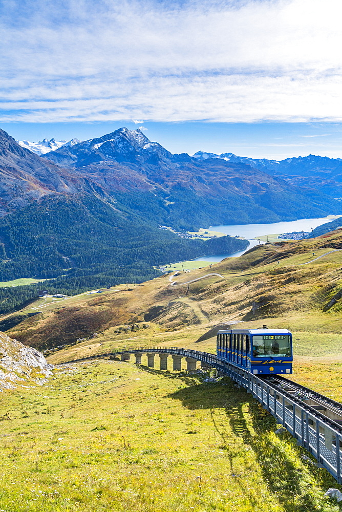 Chantarella-Corviglia funicular traveling uphill with St. Moritz lake in background, Engadine, canton of Graubunden, Switzerland, Europe