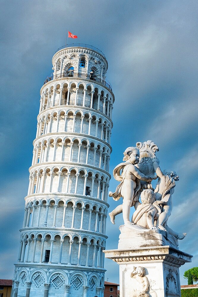 High section of Pisa Leaning Tower and marble statues of fountain, UNESCO World Heritage Site, Pisa, Tuscany, Italy, Europe