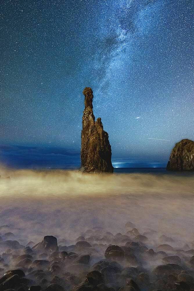 Milky Way shining on sharp rock formation of Ilheus da Rib and Ribeira da Janela in the Atlantic Ocean, Madeira, Portugal, Atlantic, Europe