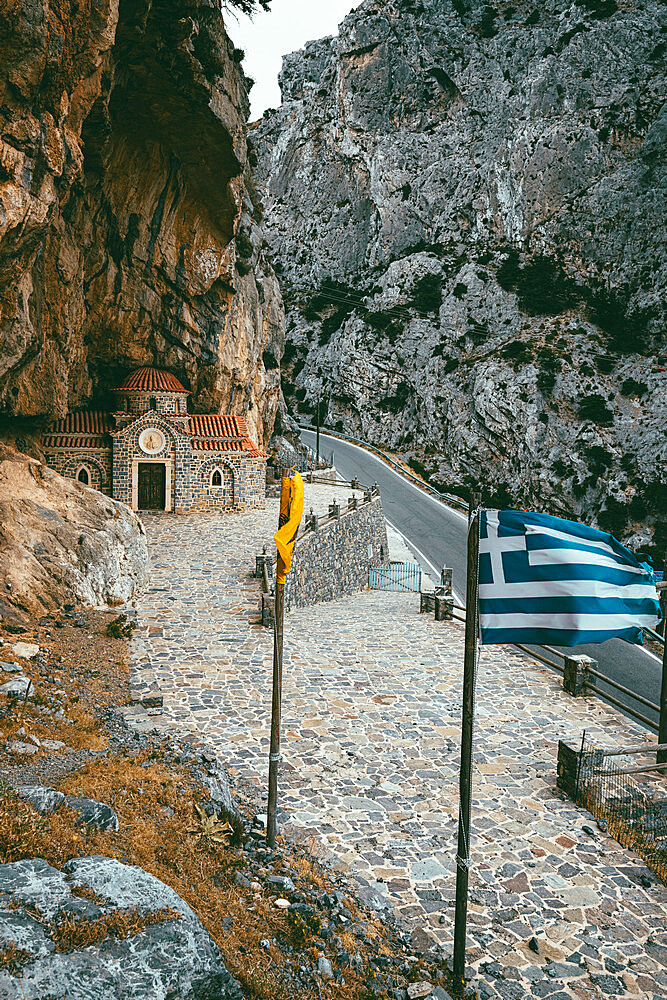 Narrow road crossing Kotsifou gorge nearby the old Agios Nikolaos chapel built in rocks, Crete island, Greek Islands, Greece, Europe