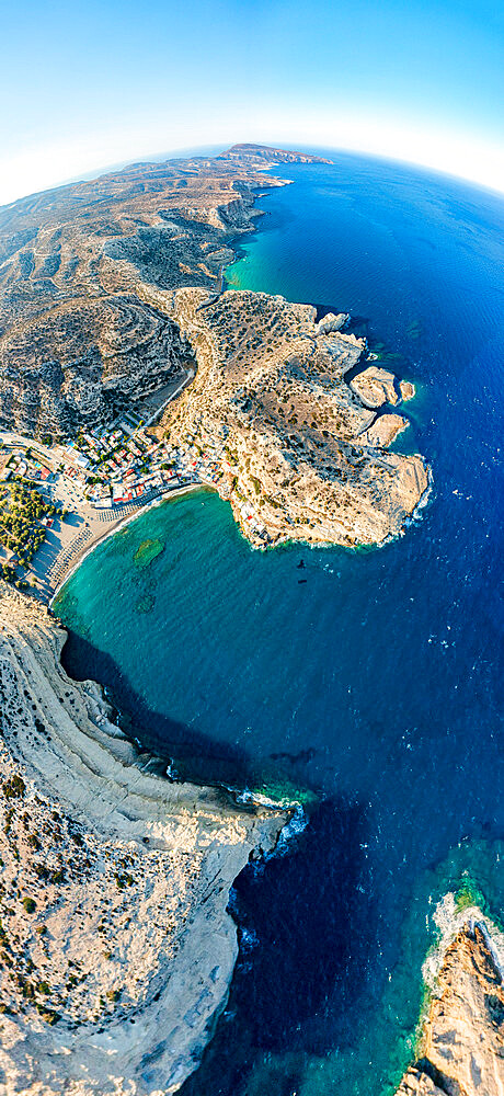 Aerial panoramic view of cliffs surrounding the beach of Matala seaside town, Crete, Greek Islands, Greece, Europe