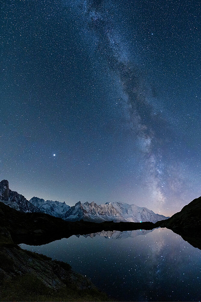 Milky Way in the starry sky over Mont Blanc and Grandes Jorasses view from Lacs de Cheserys, Chamonix, Haute Savoie, French Alps, France, Europe