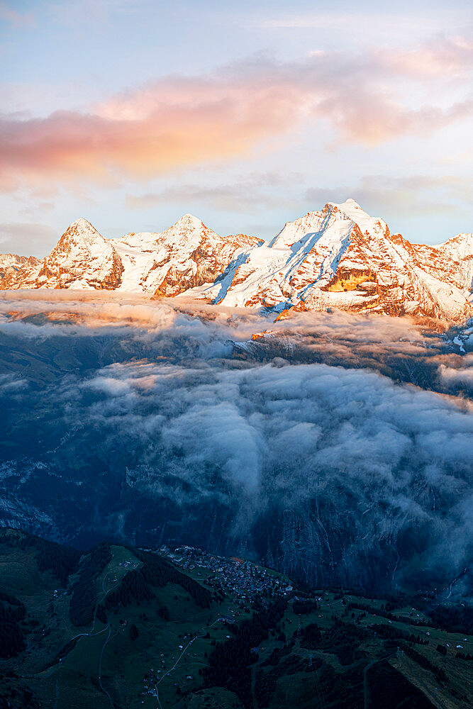 Aerial view of snowcapped peaks of Eiger, Monch and Jungfrau in fog at sunset, Murren Birg, Jungfrau Region, Bern, Swiss Alps, Switzerland, Europe