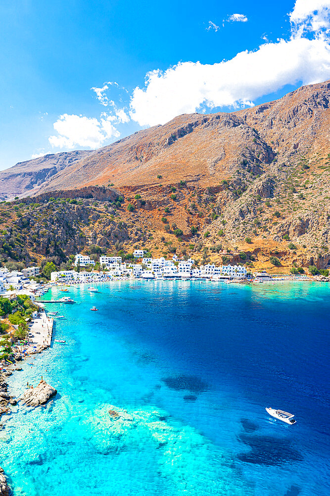 Aerial view of seaside village of Loutro nestled in the idyllic cove washed by turquoise sea, Crete island, Greek Islands, Greece, Europe