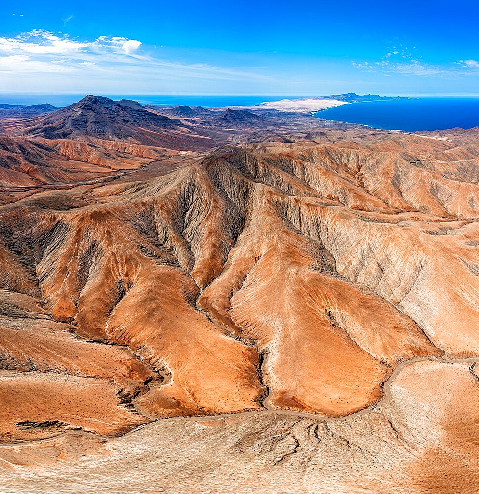 Rough volcanic mountains with the blue ocean in background from Sicasumbre viewpoint, Fuerteventura, Canary Islands, Spain, Atlantic, Europe