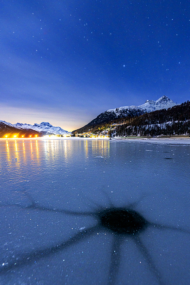 Cracked ice on the frozen surface of Lake Champfer in winter, Silvaplana, Engadine, canton of Graubunden, Switzerland, Europe