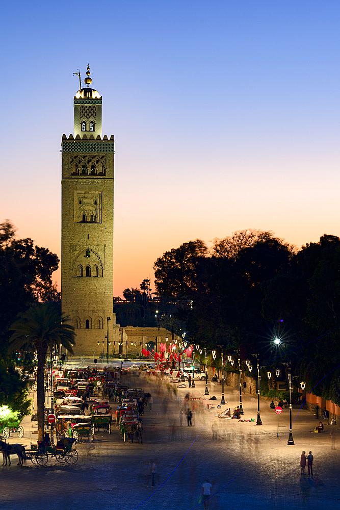 Ancient Koutoubia Mosque, UNESCO World Heritage Site, and Jemaa el Fna road at twilight, Marrakech, Morocco, North Africa, Africa