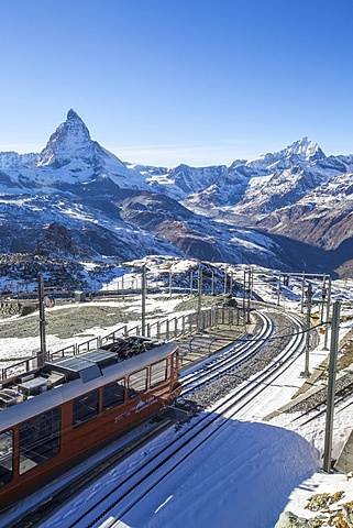 A train from Zermatt approaching the Gornergrat Station facing the majestic shape of the Matterhorn, Switzerland