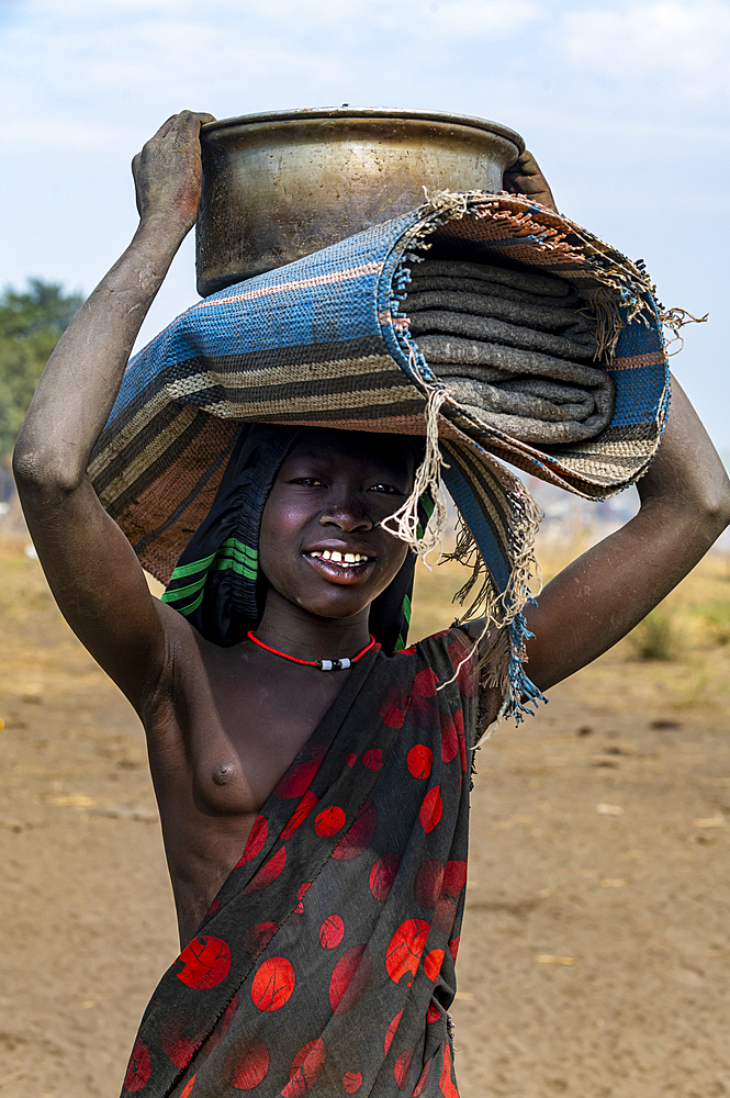 Mundari woman on the way to a water hole, Mundari tribe, South Sudan, Africa