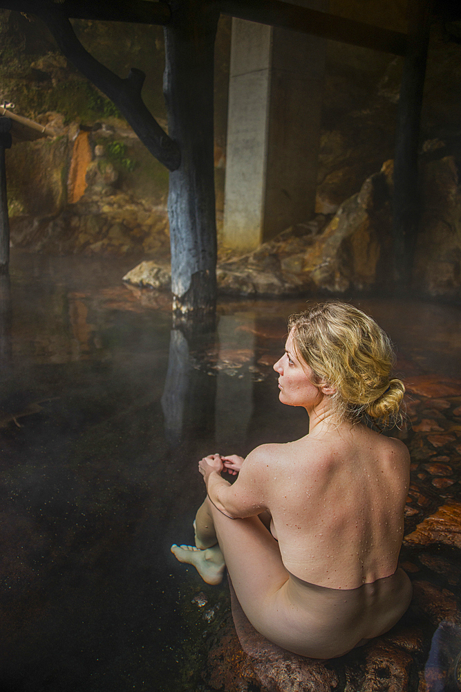 Woman enjoying the hot waters of the Kurokawa Onsen, public spa, Kyushu, Japan, Asia