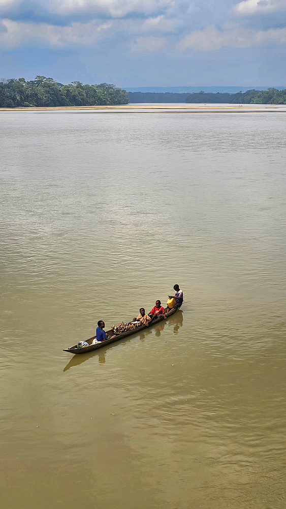 Locals in a canoe on the Sangha river, Unesco site Dzanga Sangha National Park, Central African Republic