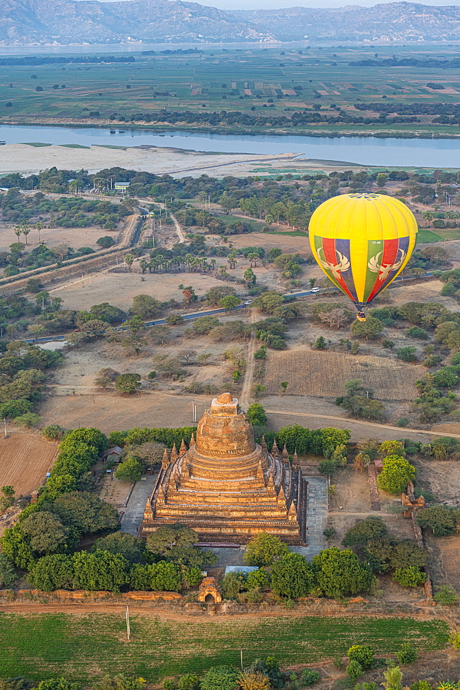 Hot air balloon at sunrise over a temple, Bagan (Pagan), Myanmar (Burma), Asia