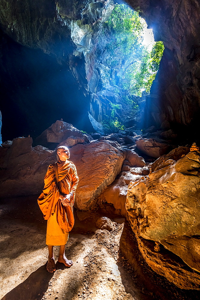 Buddhist Monk standing in Saddan Cave, Hpa-An, Kayin state, Myanmar (Burma), Asia